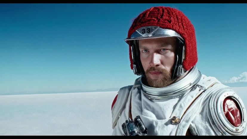 A movie trailer featuring the adventures of the 30 year old space man wearing a red wool knitted motorcycle helmet, blue sky, salt desert, cinematic style, shot on 35mm film, vivid colors.